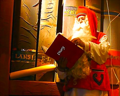  le pére noel en plein travail de préparation des fêtes